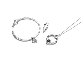 White background Explorer of Pandora jewellery bracelet ring and necklace set