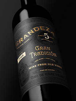 Black background Explorer of Grandeza red wine bottle close up