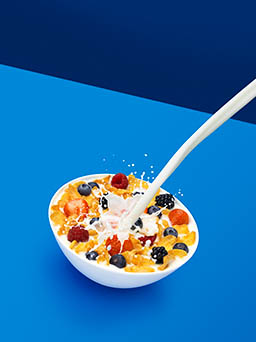 Coloured background Explorer of Koko milk cereal with milk splash
