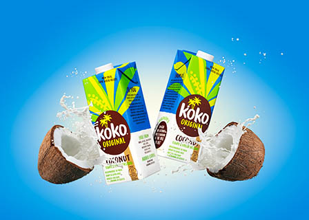 Drinks Photography of Koko milk cartons with smashing coconuts and milk splash