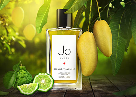 Coloured background Explorer of Jo Loves Mango Thai Lime fragrance bottle