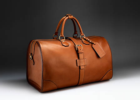 Fashion Photography of Alfred Dunhill leather travel bag