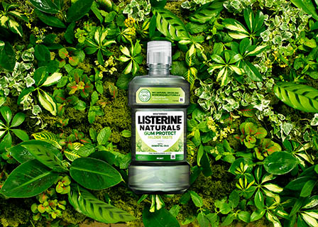 Advertising Still life product Photography of Listerine Naturals mouth wash bottle on a bed of foliage