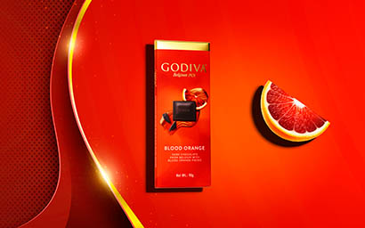 Coloured background Explorer of Godiva blood orange chocolate bar