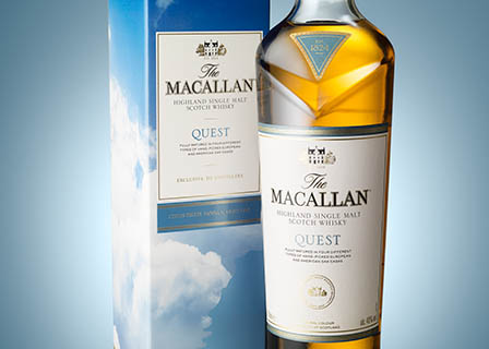 Coloured background Explorer of Macallan whisky bottle and box set