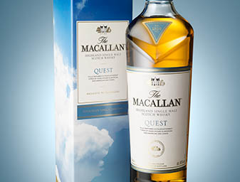 Coloured background Explorer of Macallan whisky bottle and box set