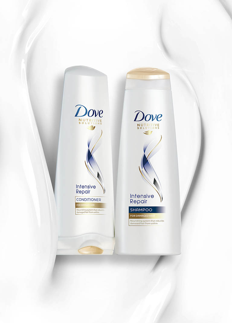Creative Still Life Product Photography and Retouching of Dove shampoo and conditioner bottles with texture by Packshot Factory